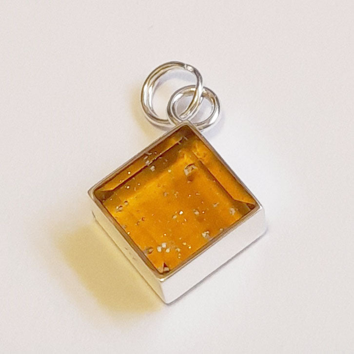 Ashes in Crystal Glass, Corner-Hung Charm.