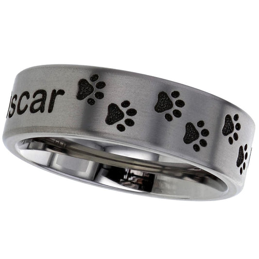 Side profile of paw print and pet name modern polished ashes titanium ring on a white background