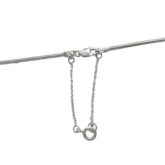 Sterling silver snake chain with safety chain on a white background