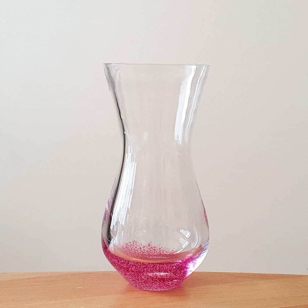 Ashes keepsake pink glass vase on table 