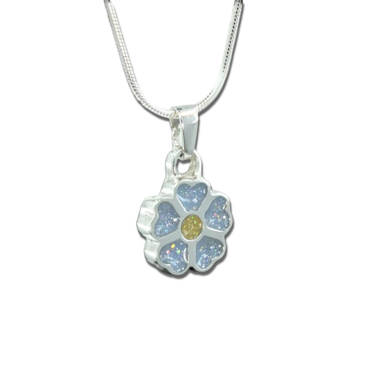 Silver forget-me-not flower shaped ashes Charm shown on a snake chain necklace with blue inlaid petals and yellow centre