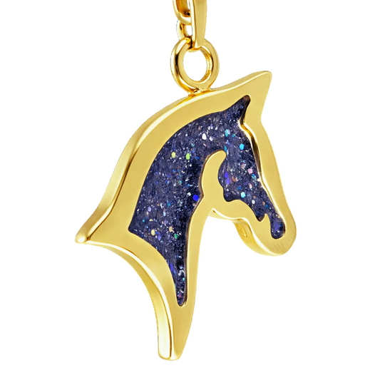 close up gold horse head silhouette shaped sparkling black pendant with snake chain on a white background