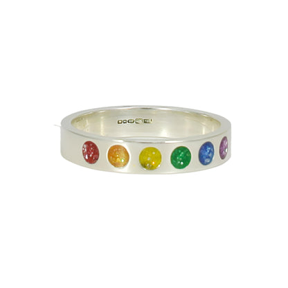 Silver ring with colorful gemstones on a white background
