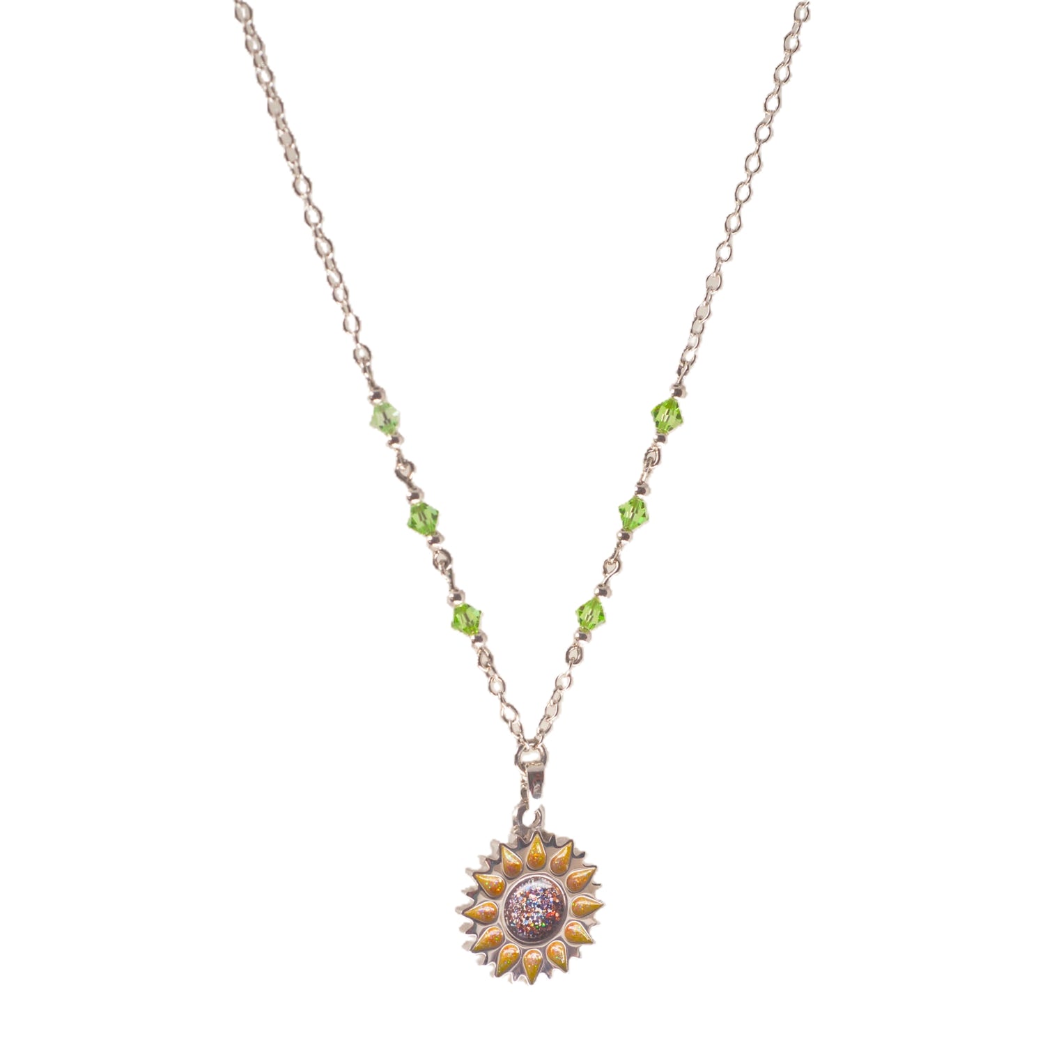 Sunflower pendant with sparkling yellow petals and a round sparkling warm orange centre on a silver long chain with green beads on a white background