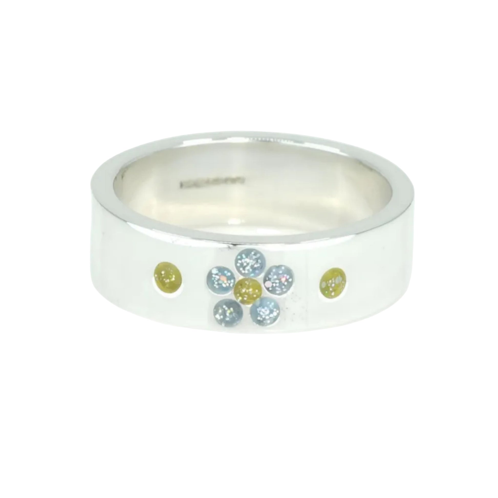 Silver band ashes ring with five small round forget not blue sparkling stones and three yellow sparkling stones shaped as a flower