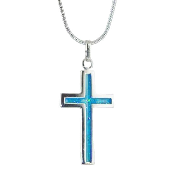Silver cross pendant on snake chain with aqua blue sparkling colour inlay on a white background
