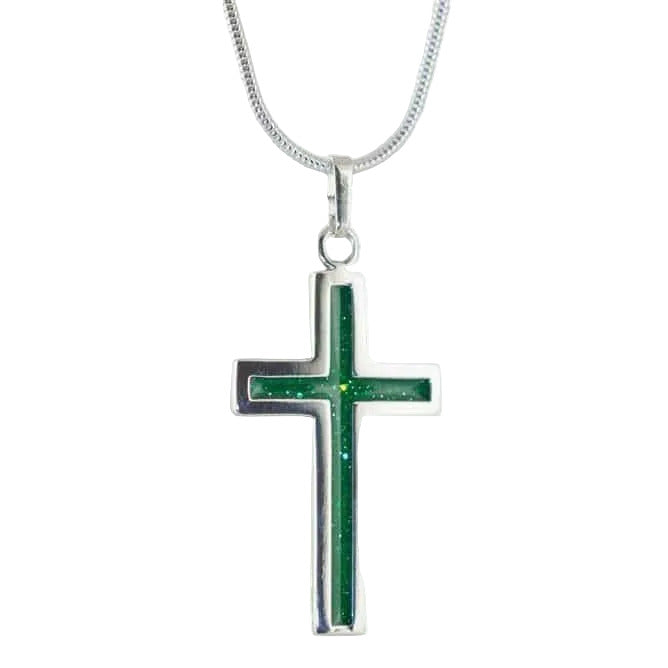 Silver cross pendant on snake chain with green sparkling colour inlay on a white background