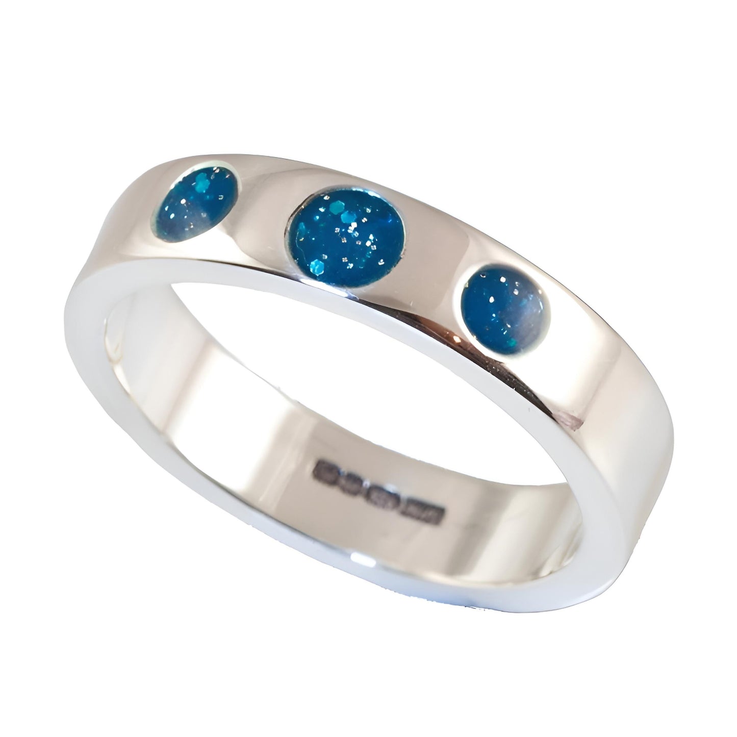 Ashes Silver ring with three blue gemstones on a white background