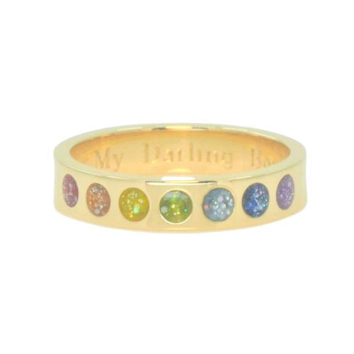 Yellow gold ring for ashes with seven rainbow coloured round stones on a white background