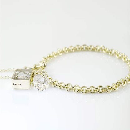 Ashes in Crystal Glass, Corner-Hung Charm.