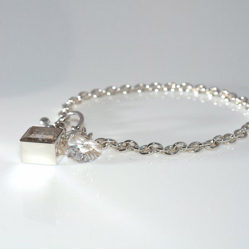 Ashes in Crystal Glass, Corner-Hung Charm.